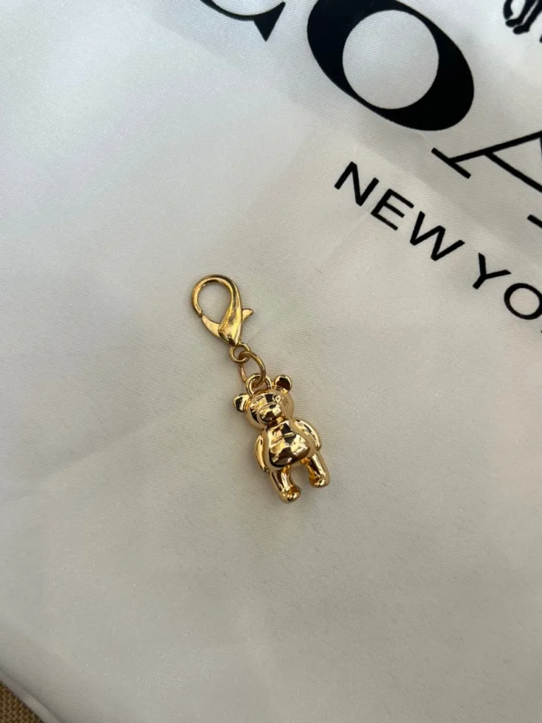 Coach tiny charms