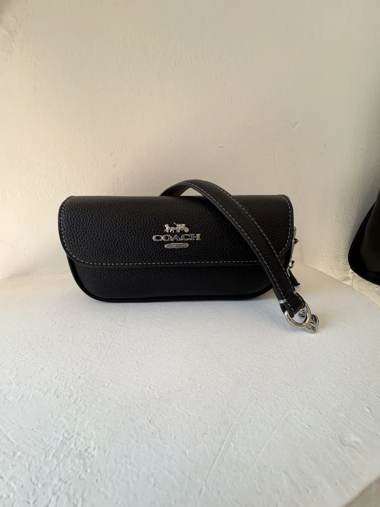Coach black leather clutch with strap