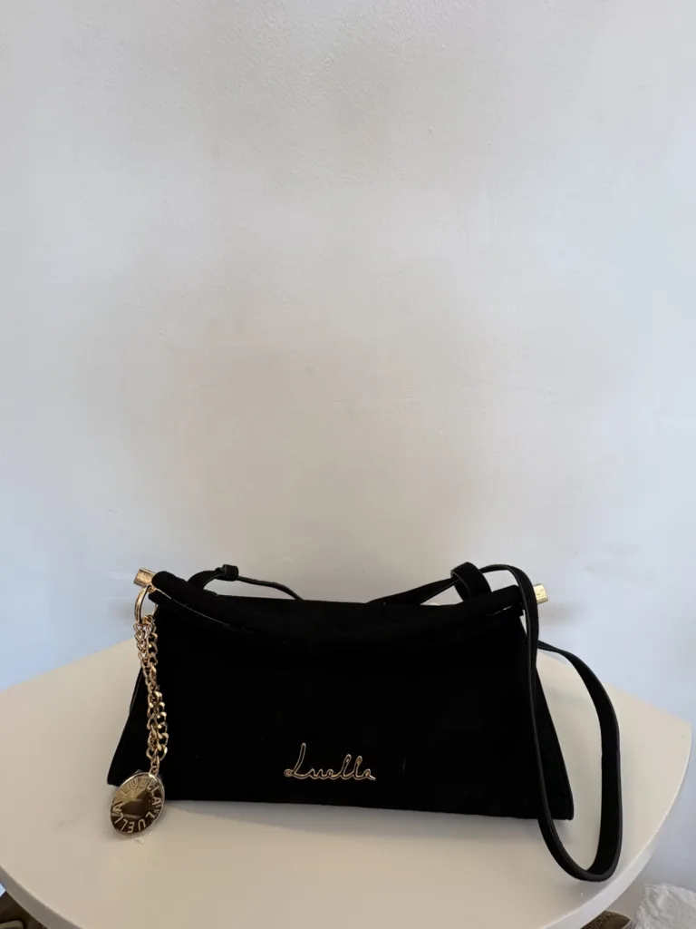 Luella black crossbody with gold charm