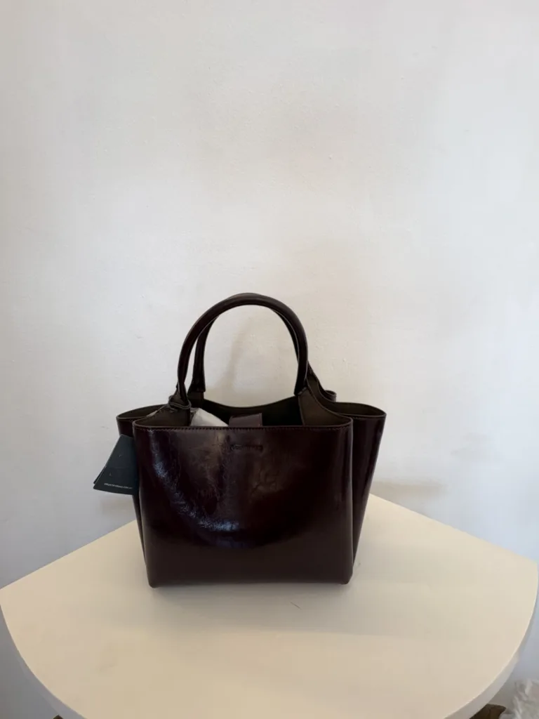 Dark burgundy patent winged tote