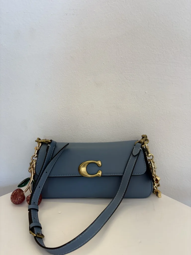 Coach denim flap crossbody with cherry charm