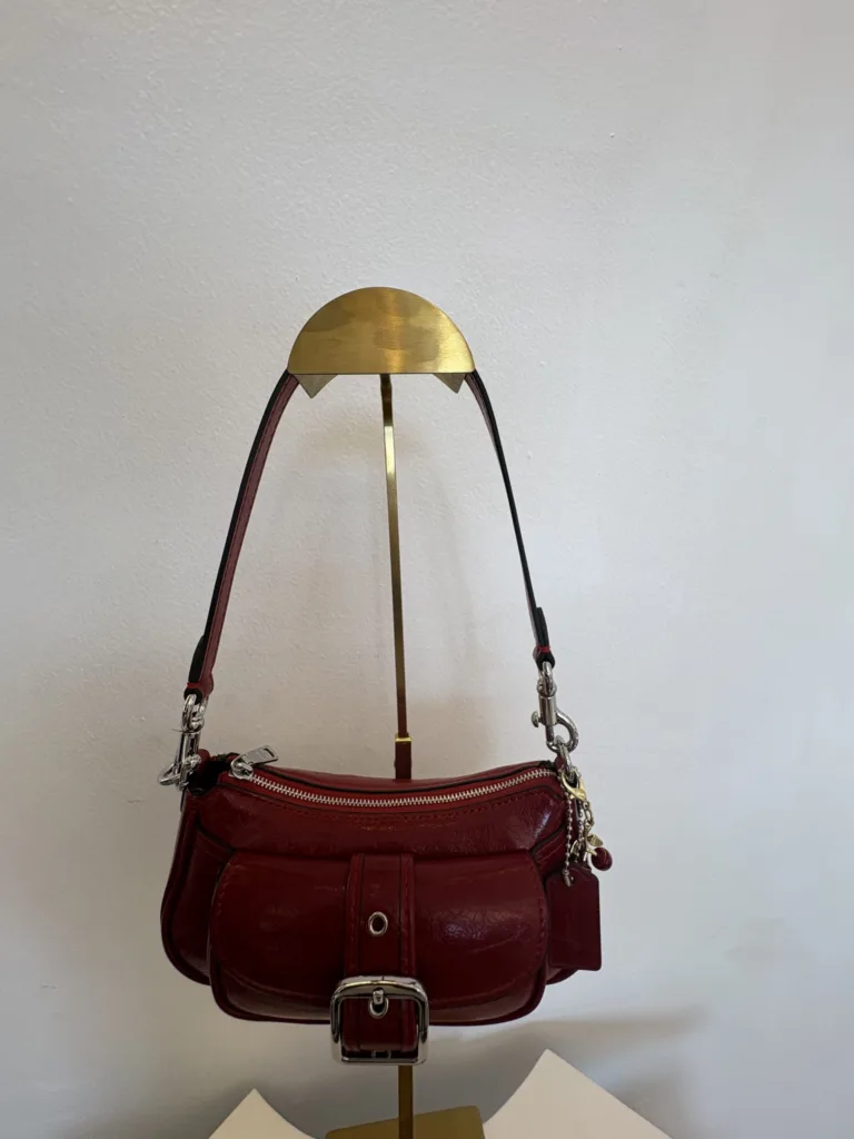 Coach red leather shoulder bag with buckle strap