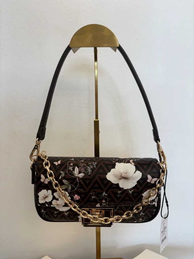 Black floral flap bag with camellia and chain